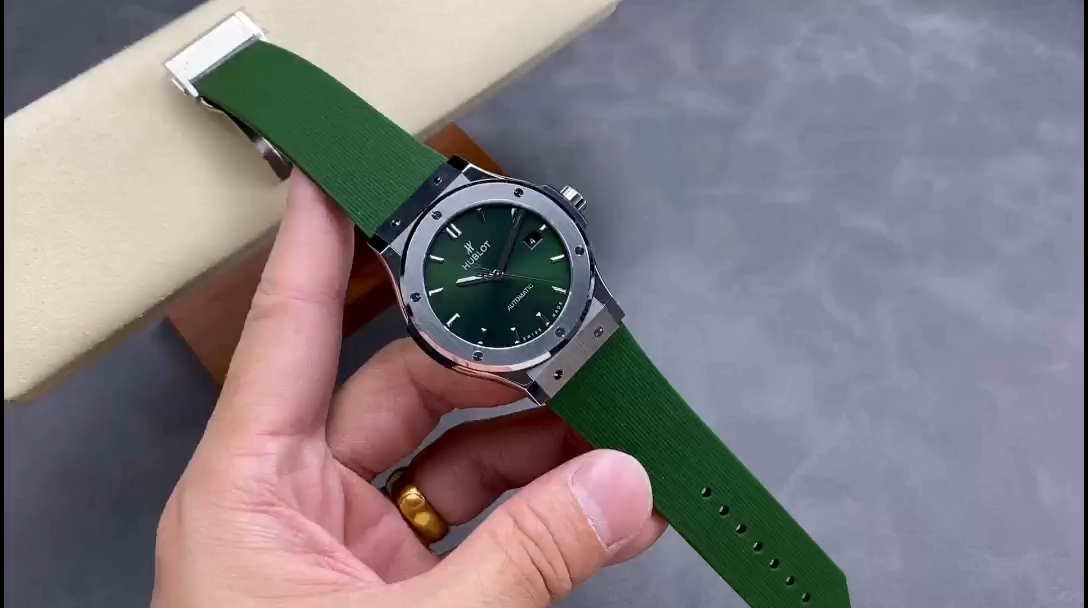 Handheld shot of Hublot Classic Fusion 542.NX.8970.RX, green dial and strap shown from the front. - Video