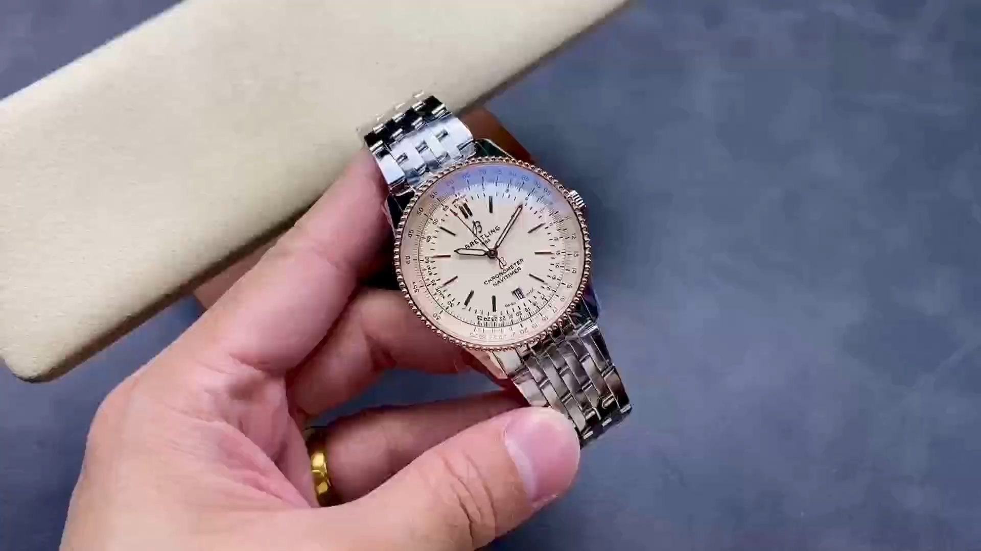 Hand-held view of Breitling Navitimer U17326211G1A1 showing bracelet and case profile. - Video