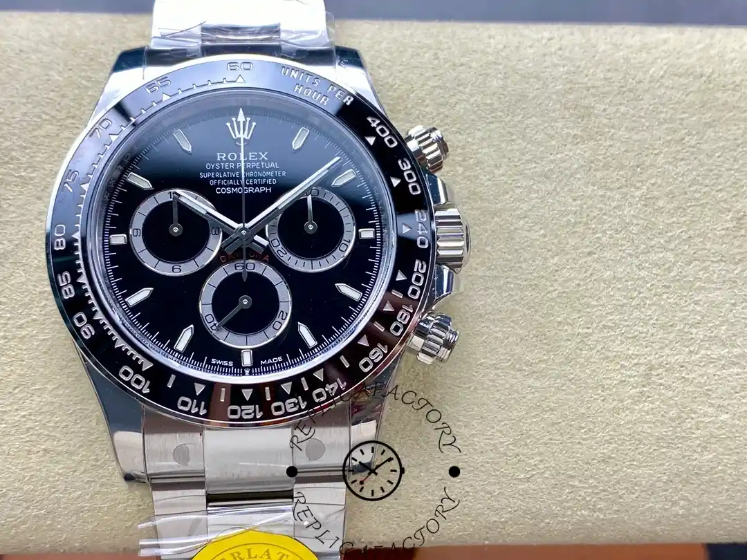 Rolex Cosmograph Daytona m126500ln-0002 on cushion, full dial view with black ceramic bezel.