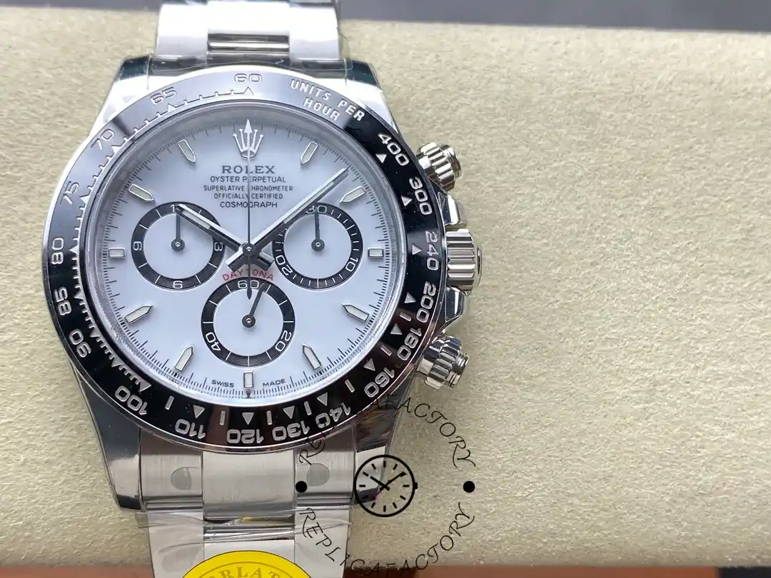 Rolex Daytona M126500LN-0001 front view on pad, white dial and black bezel.