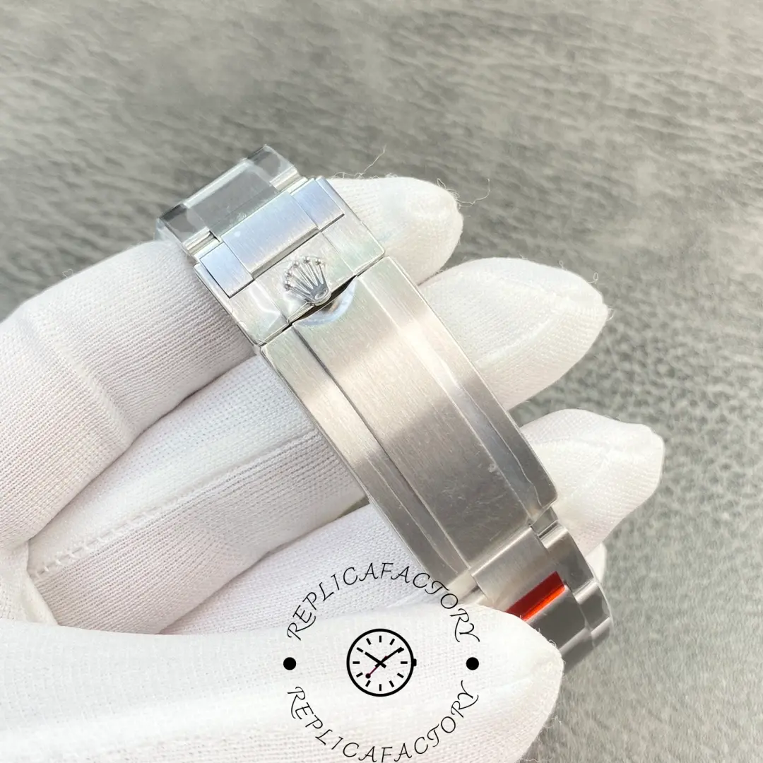 Rolex Submariner 114060, clasp close-up showing Rolex coronet engraving on the buckle.