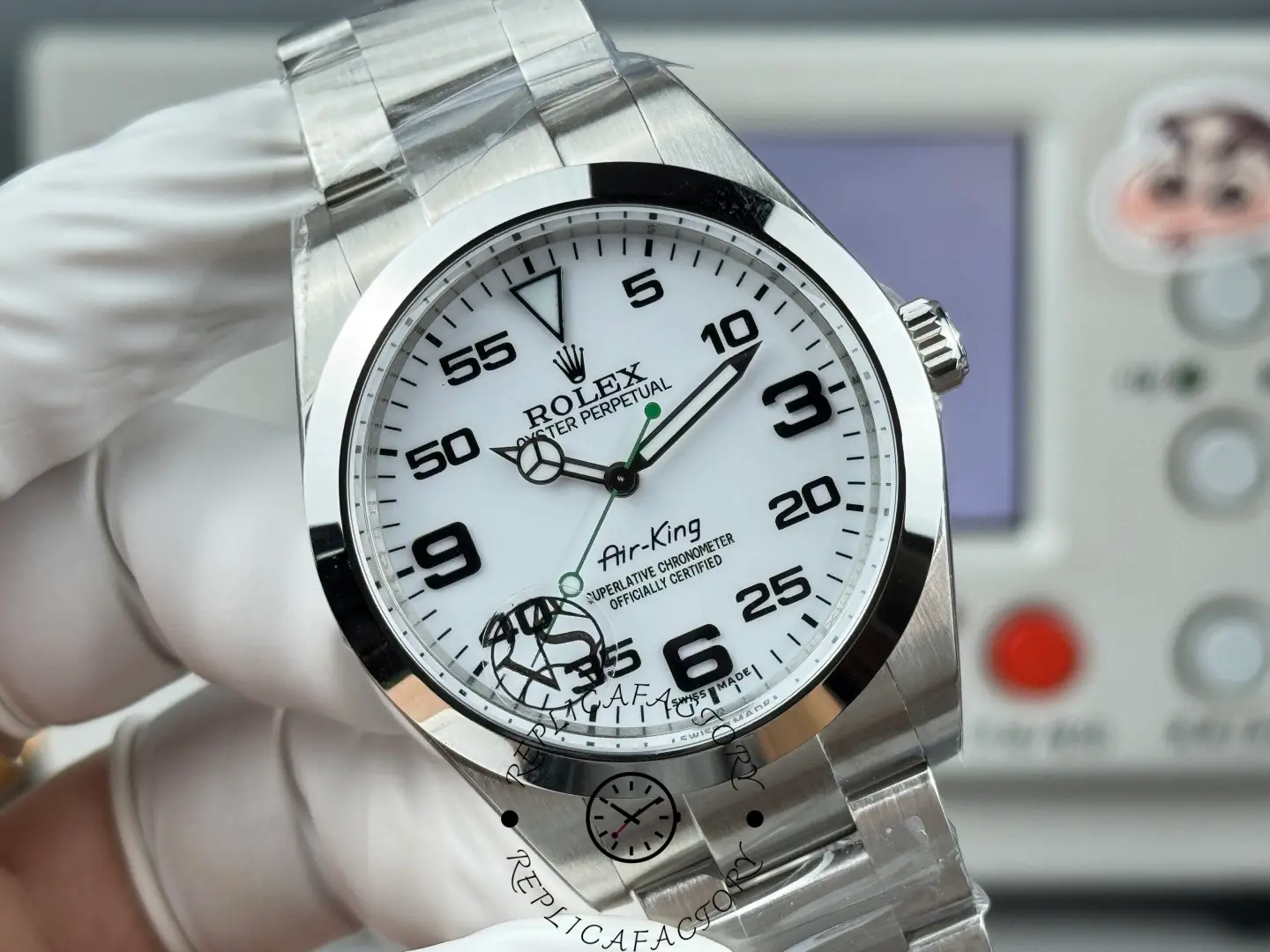 Rolex Air-King 126900 close-up, white dial and hands, Oyster bracelet, front angle.