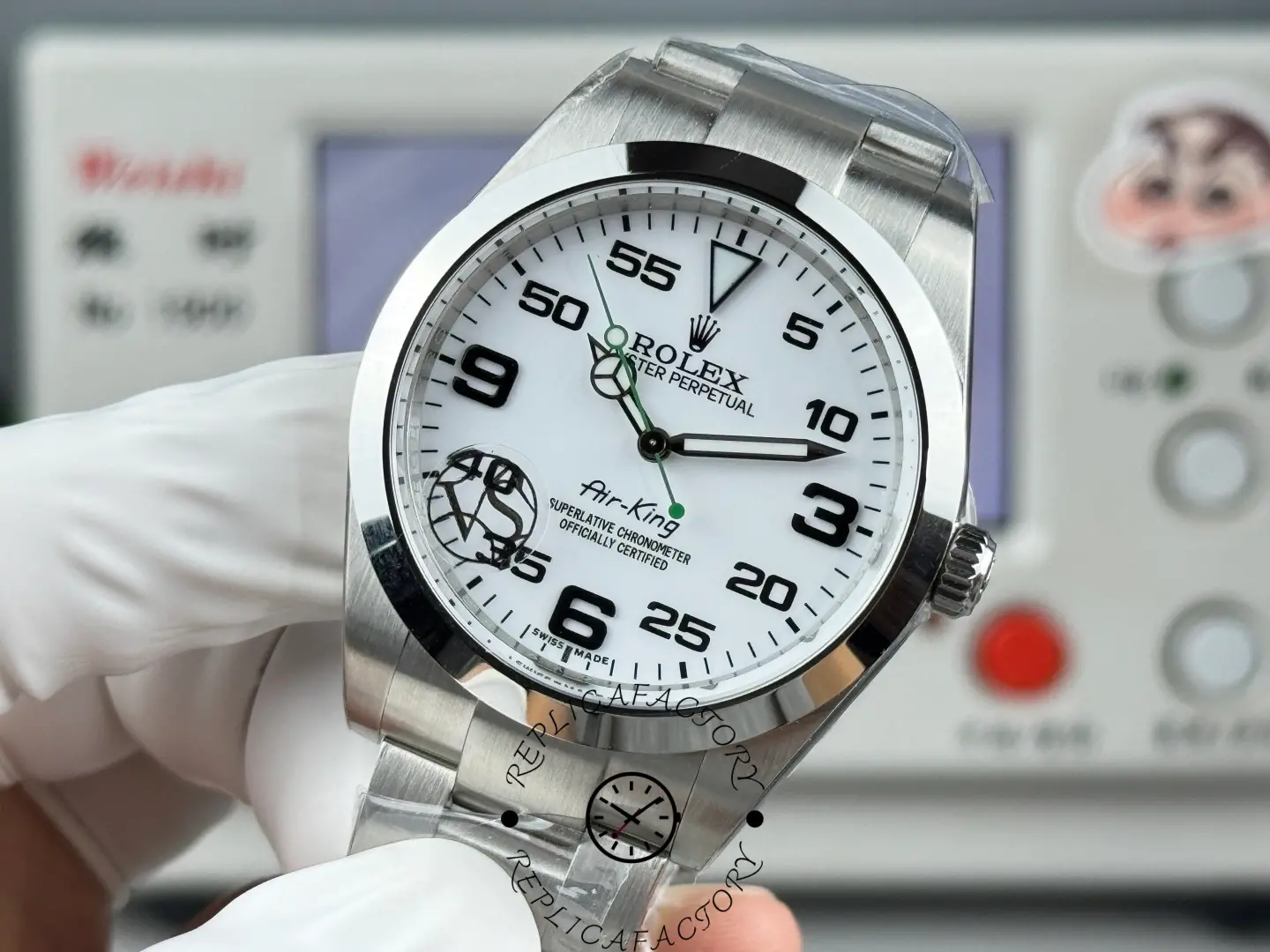 Rolex Air-King 126900 macro front view, white dial details, Oyster bracelet visible.