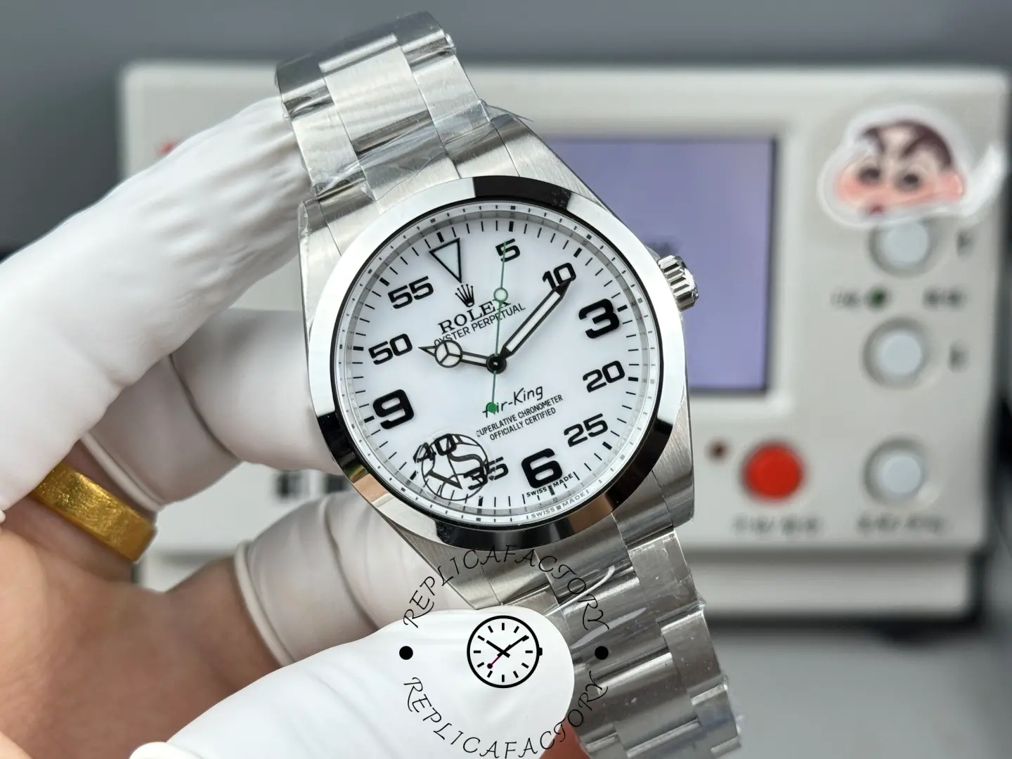 Rolex Air-King 126900 dial close-up, white dial with Arabic numerals, smooth bezel.