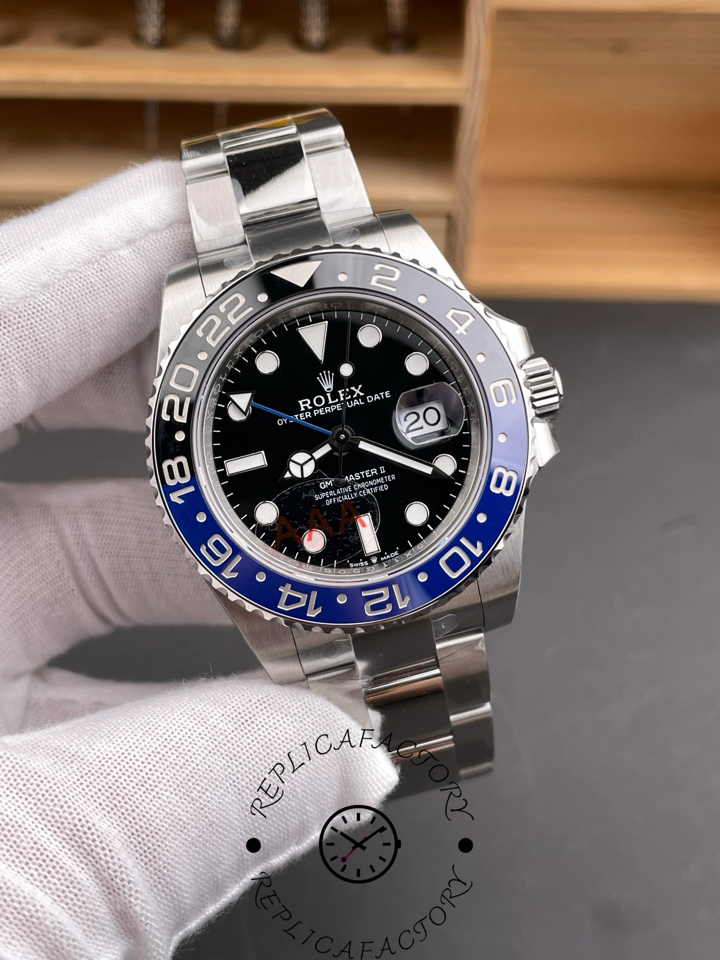 Rolex GMT-Master II 126710BLNR 0003 in glove, black dial, blue-black bezel, Oyster bracelet, front view.