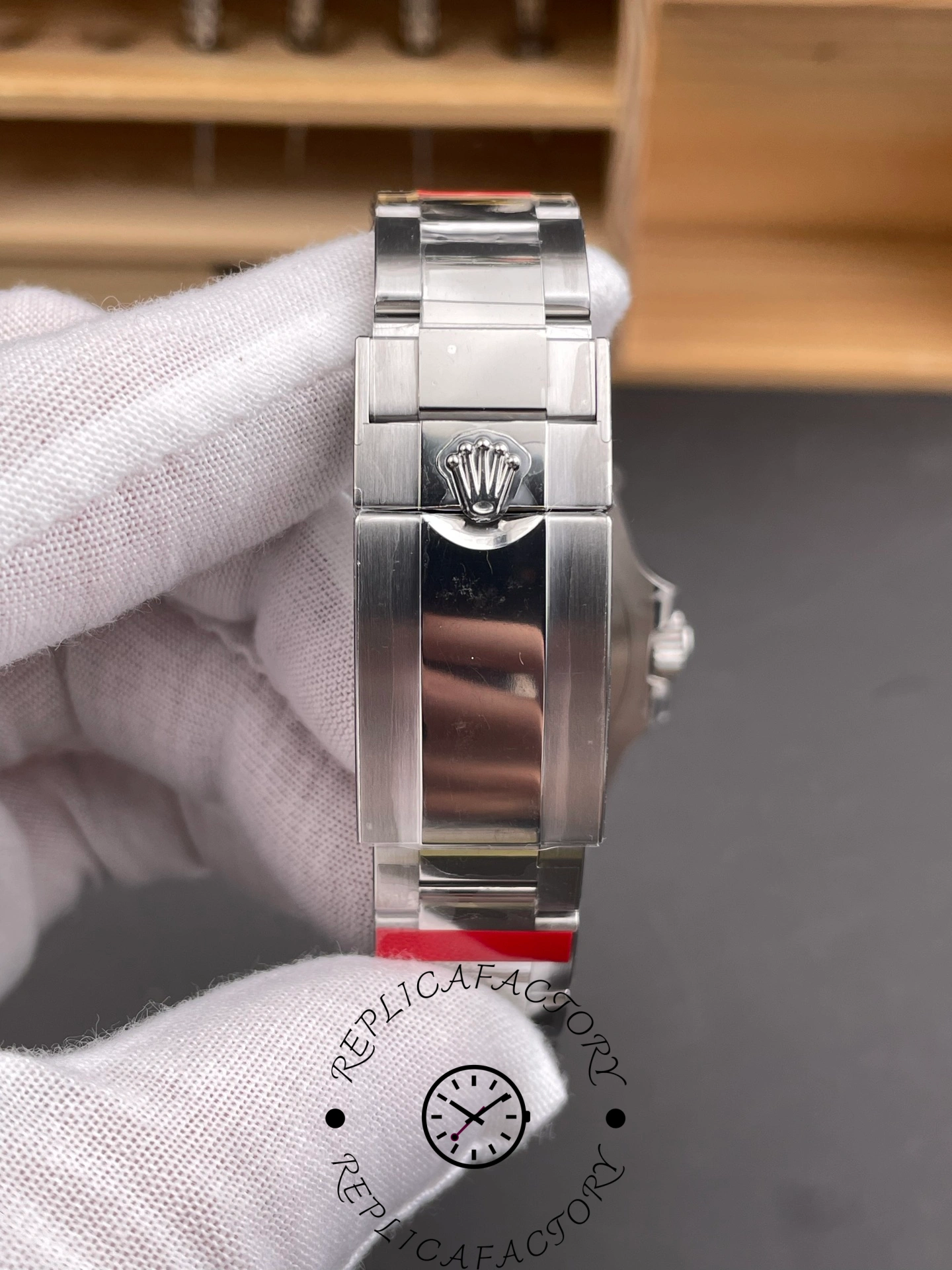 Rolex GMT-Master II 126710BLNR 0003 clasp view, Oyster clasp and links, held in glove.