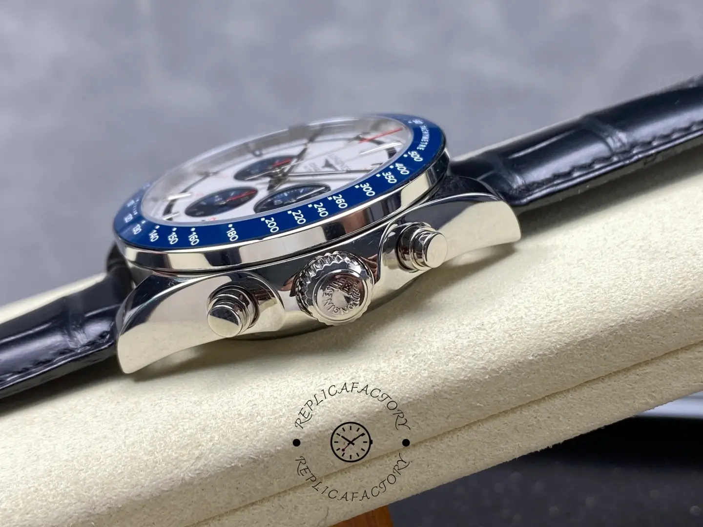 Longines Conquest Chronograph L3.835.4.98.9, side view showing crown, pushers, and leather strap attachment.