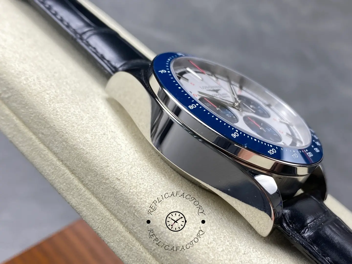 Longines Conquest Chronograph L3.835.4.98.9, angled case view highlighting polished lugs and blue bezel.