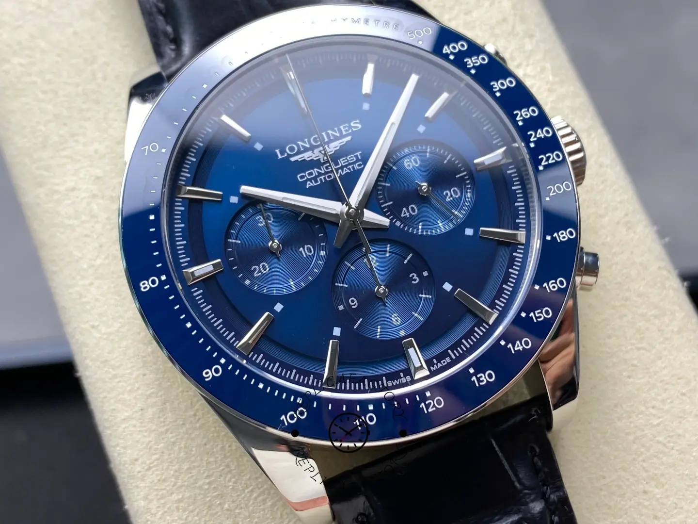 Detailed macro shot of the Longines Conquest L3.835.4.92.6 blue dial chronograph hands.