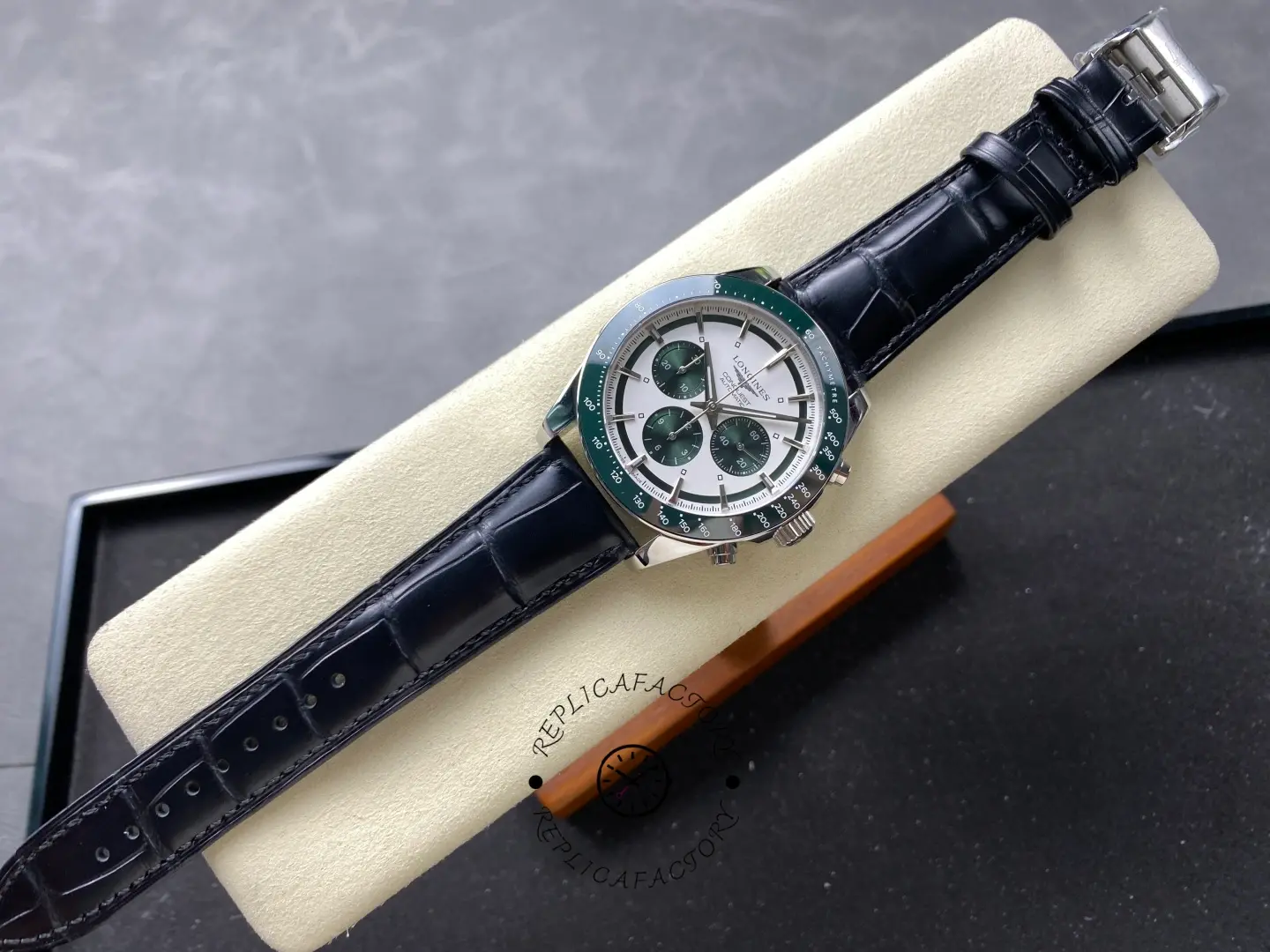 Longines Conquest Chronograph L3.835.4.02.6, full view with green bezel and black leather strap on display.