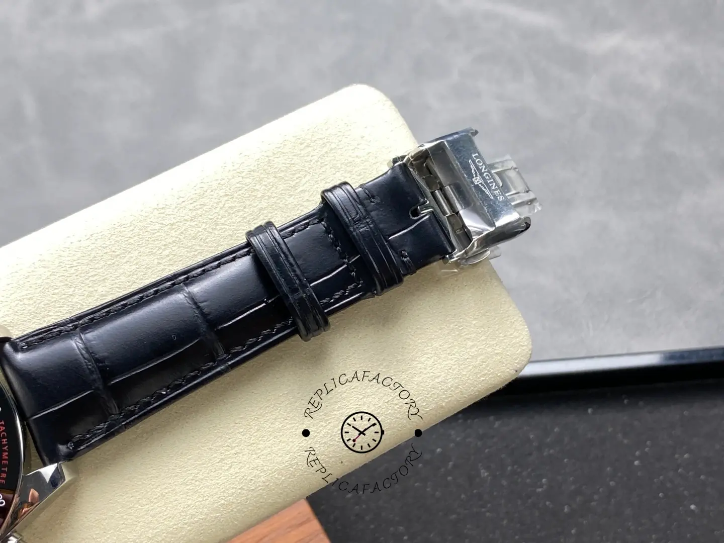 Longines Conquest L3.835.4.52.6 clasp close-up with engraved Longines logo.