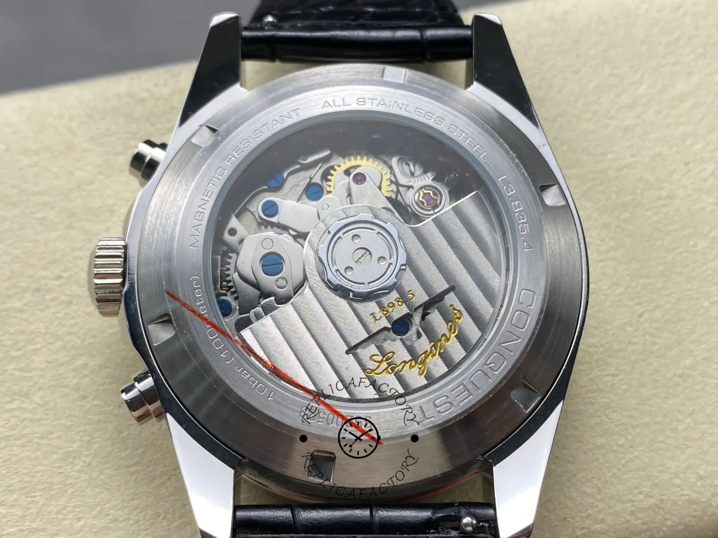 Longines Conquest Chronograph L3.835.4.72.6, exhibition caseback showing rotor and movement details.