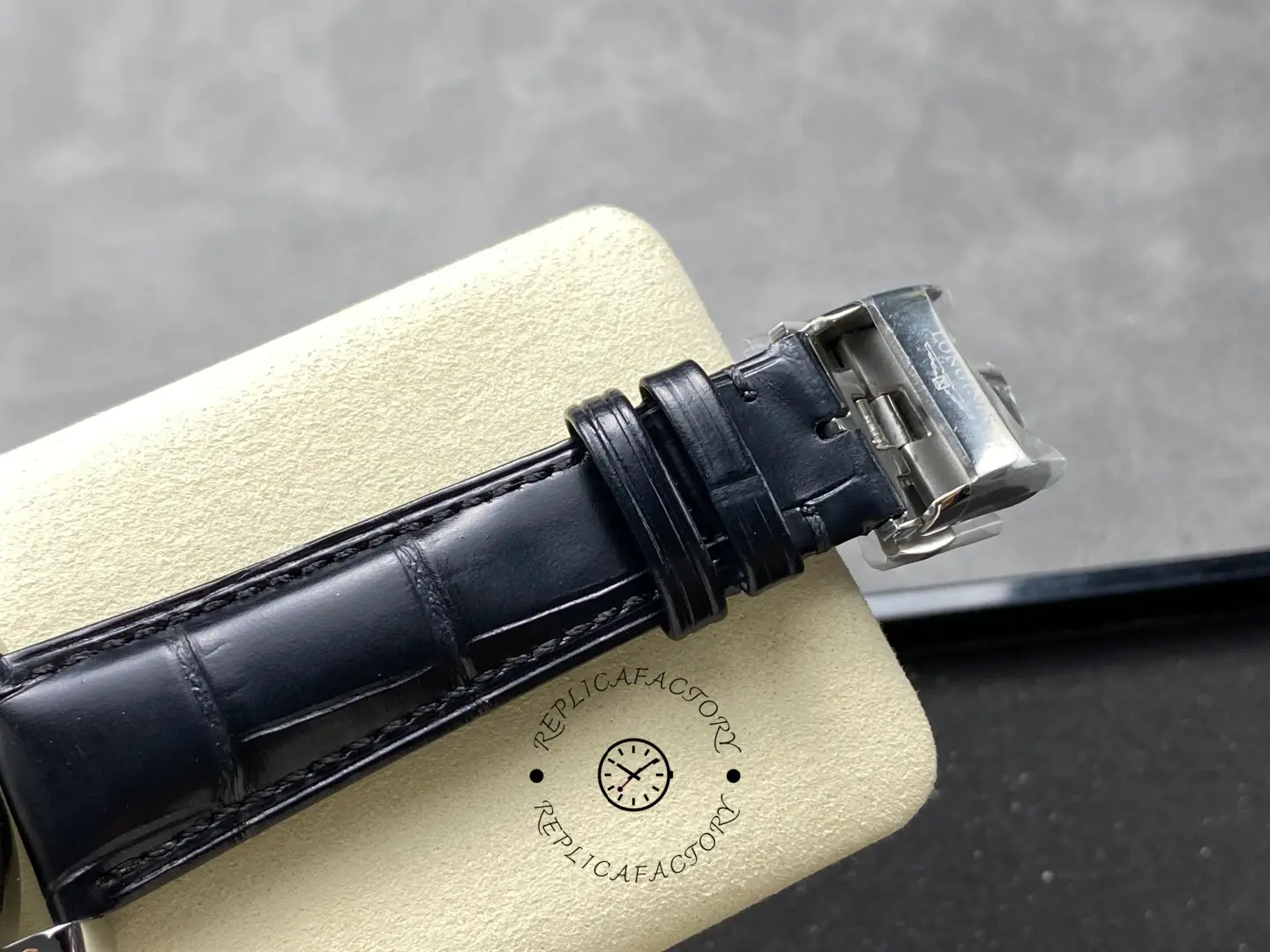 Longines Conquest Chronograph L3.835.4.72.6, clasp detail of black leather strap with engraved Longines logo.