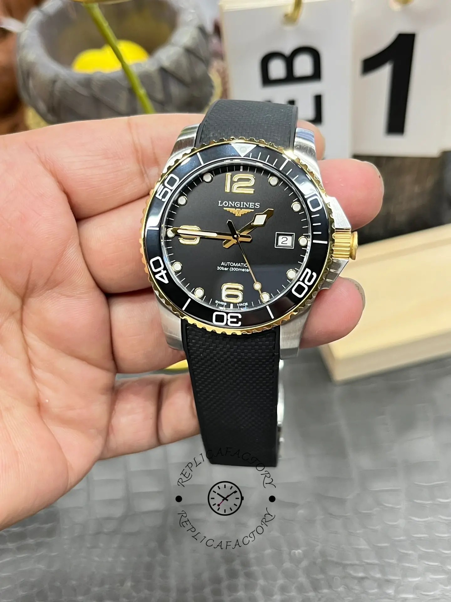 Full view of Longines HydroConquest L3.781.3.56.9, black dial and rubber strap combination.