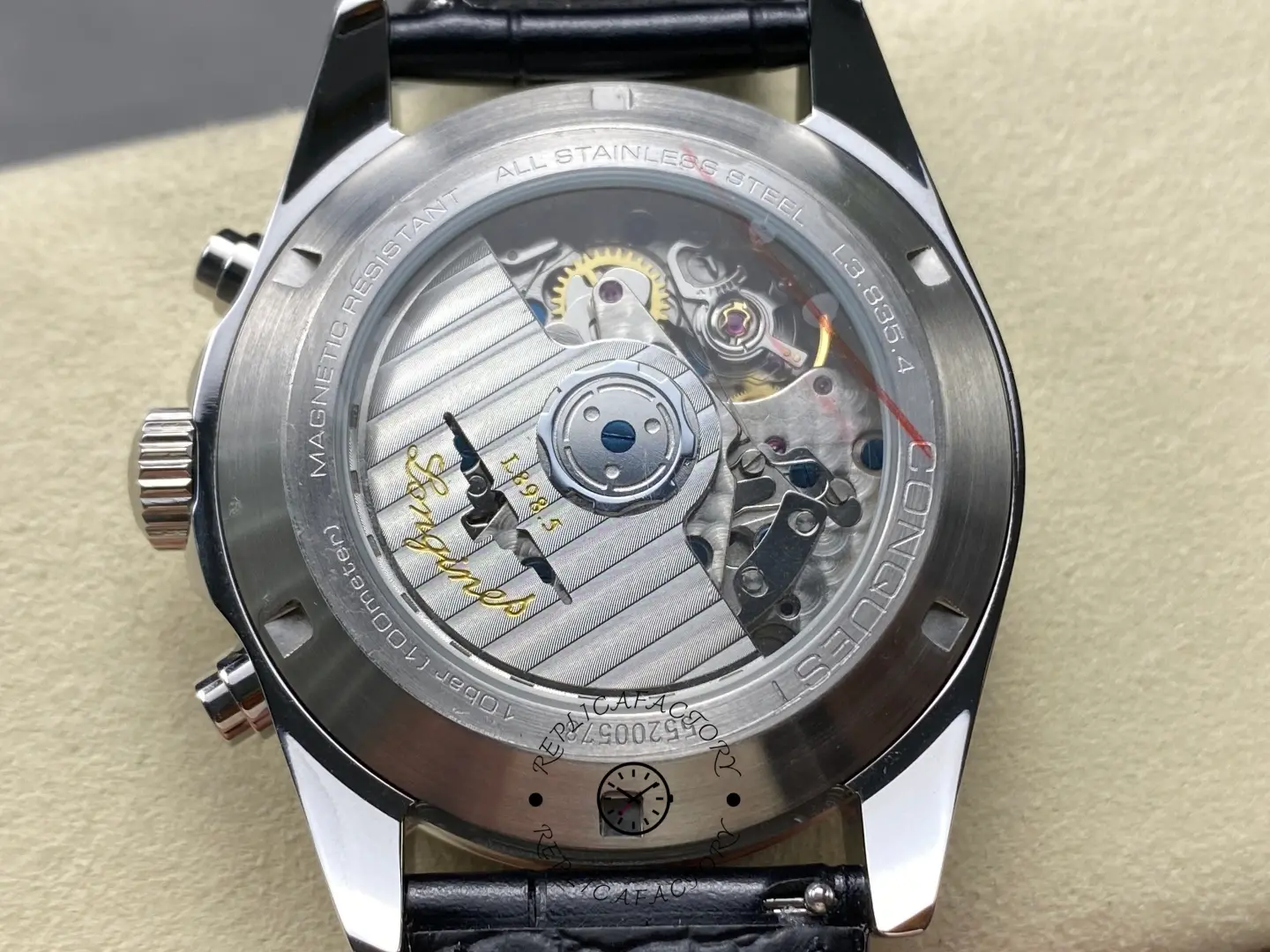 Longines Conquest Chronograph L3.835.4.98.9, exhibition caseback showing automatic movement through sapphire crystal.