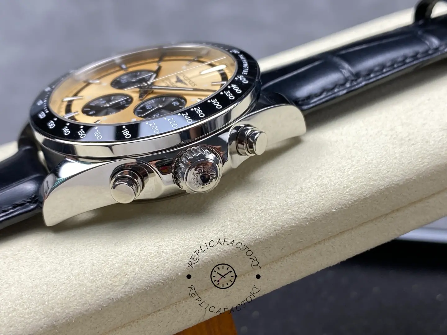 Longines L3.835.4.32.9 side view showing crown and chronograph pushers on black leather strap.