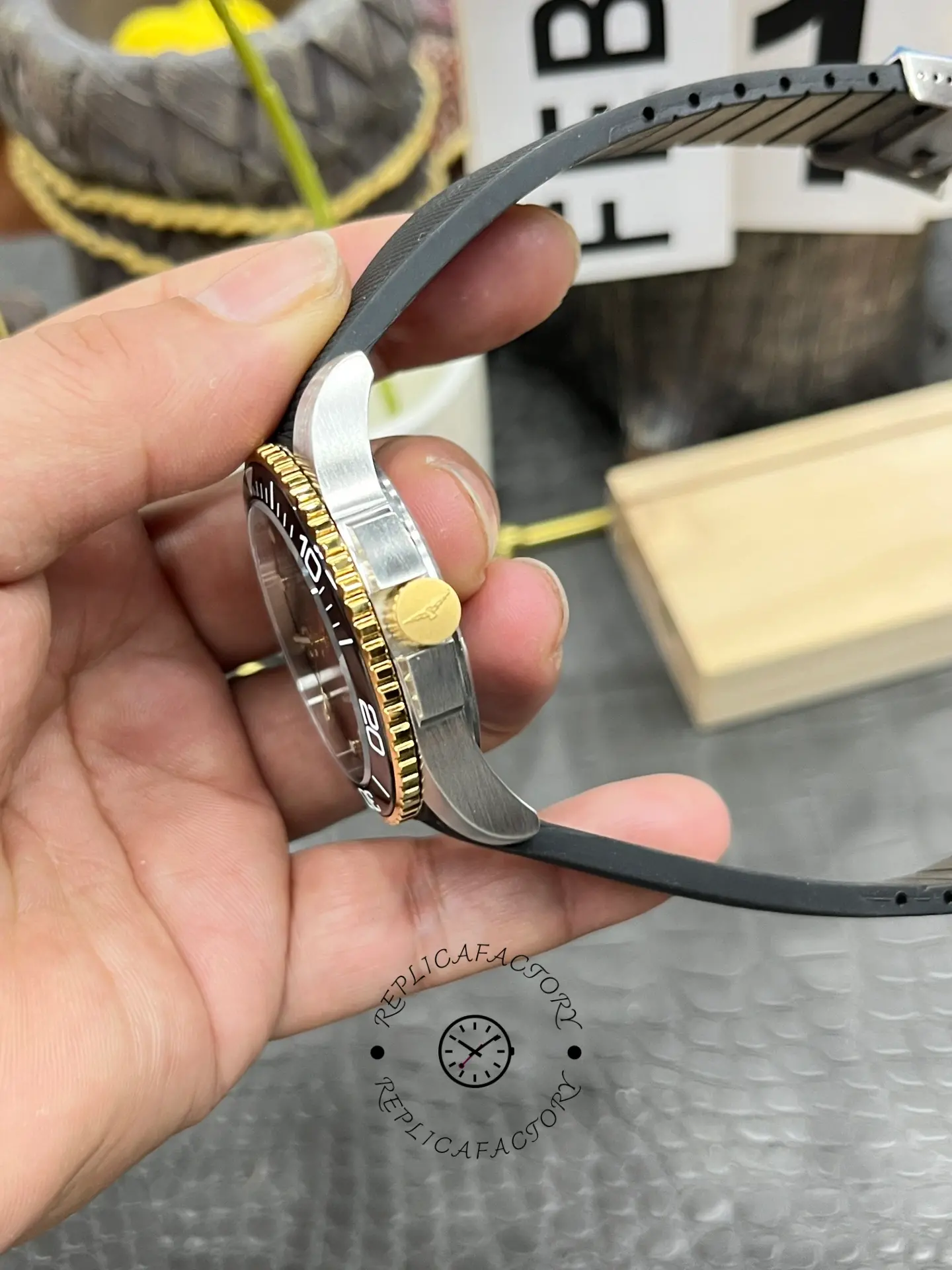 Side view of Longines HydroConquest L3.781.3.56.9 showing gold crown and bezel edge.