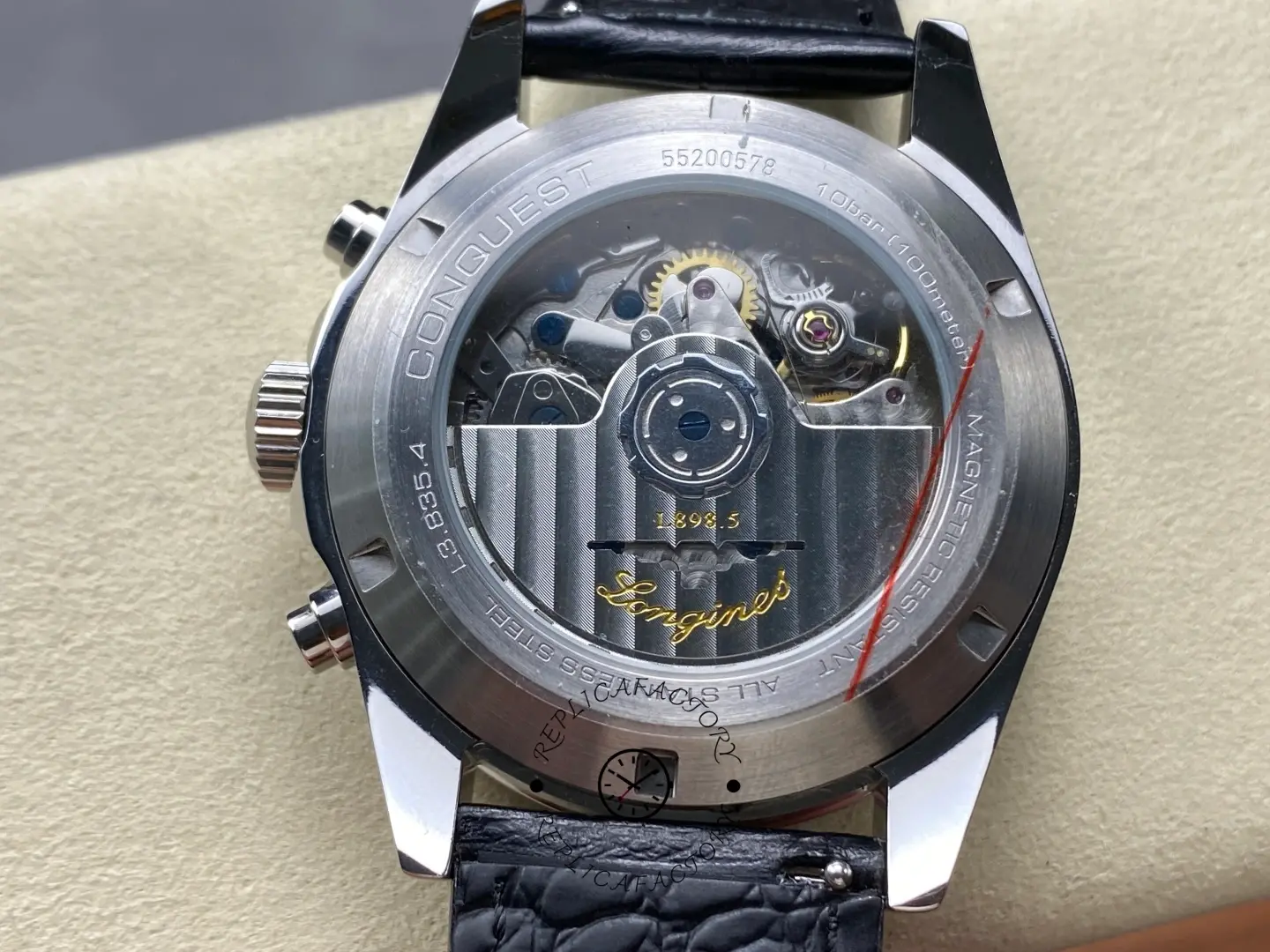 Longines L3.835.4.32.9 exhibition caseback showing automatic movement and Conquest engravings.