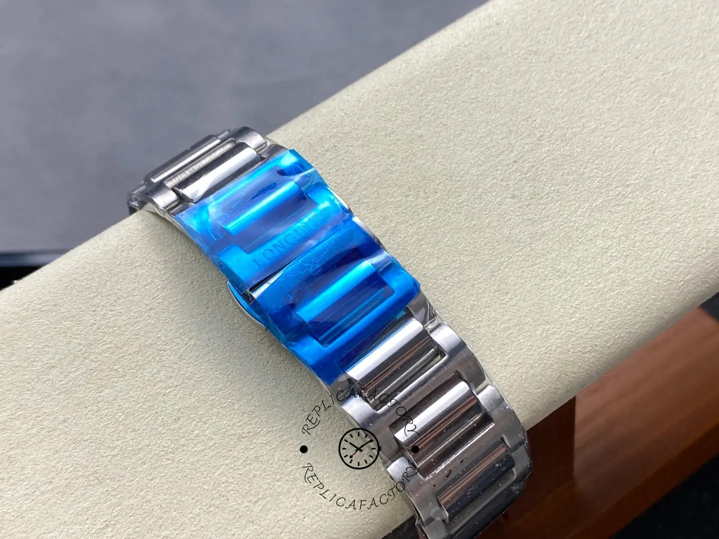 Longines Conquest Chronograph L3.835.4.98.6, bracelet clasp detail with protective blue film and Longines engraving.