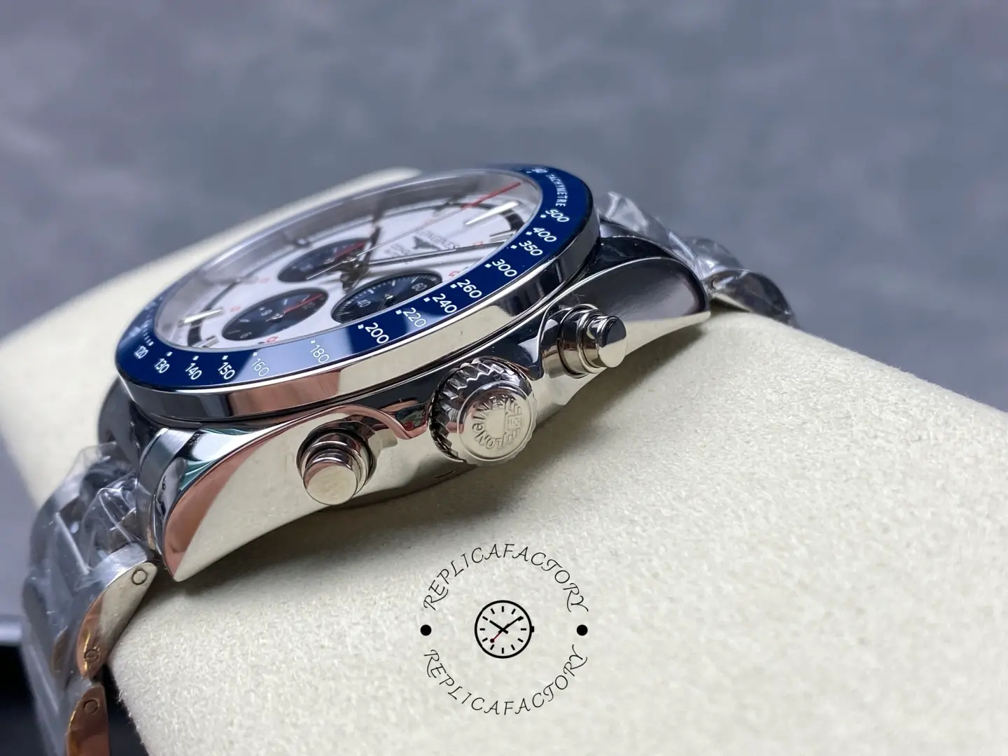 Longines Conquest Chronograph L3.835.4.98.6, side view showing crown, chronograph pushers, and blue bezel edge.