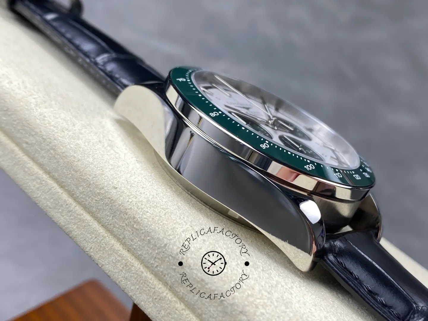 Longines Conquest Chronograph L3.835.4.02.6, angled side view showing polished case and green bezel edge.