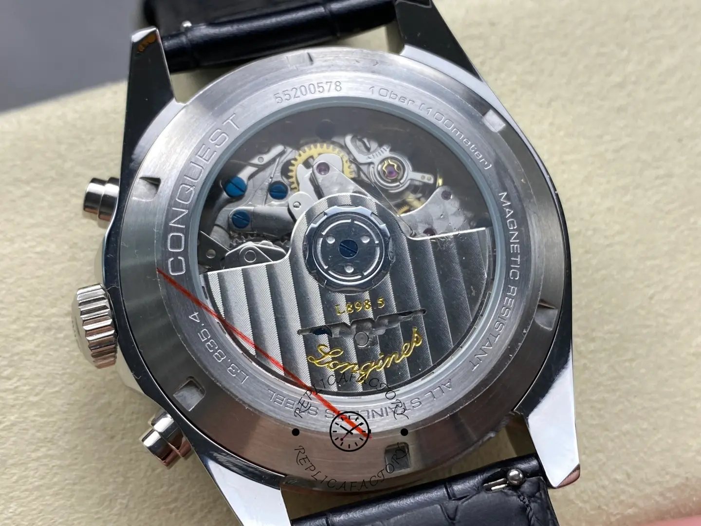 Longines Conquest Chronograph L3.835.4.02.6, exhibition caseback showing movement and rotor engraving.