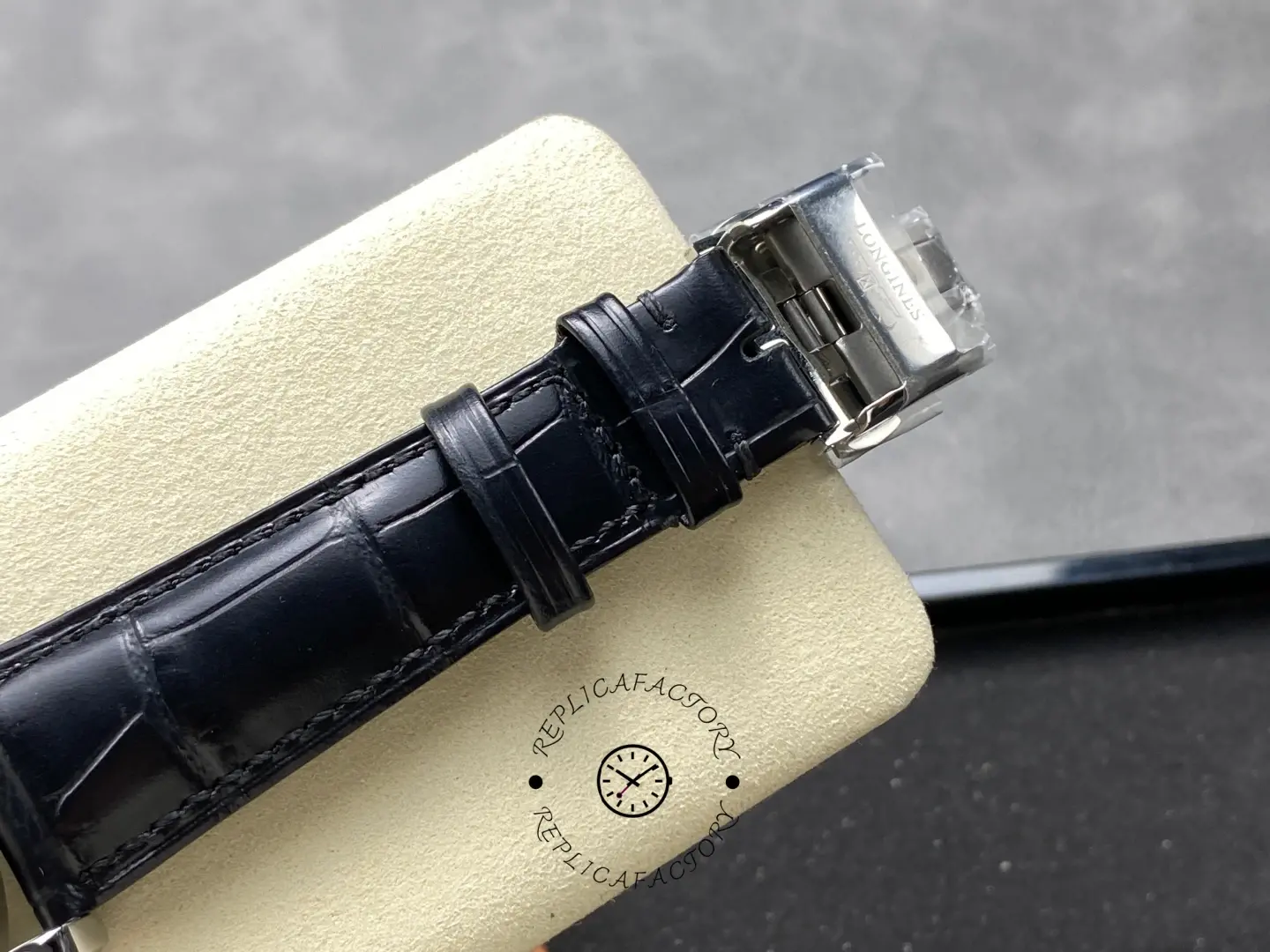 Longines Conquest Chronograph L3.835.4.02.6, clasp detail of black leather strap with Longines engraving.