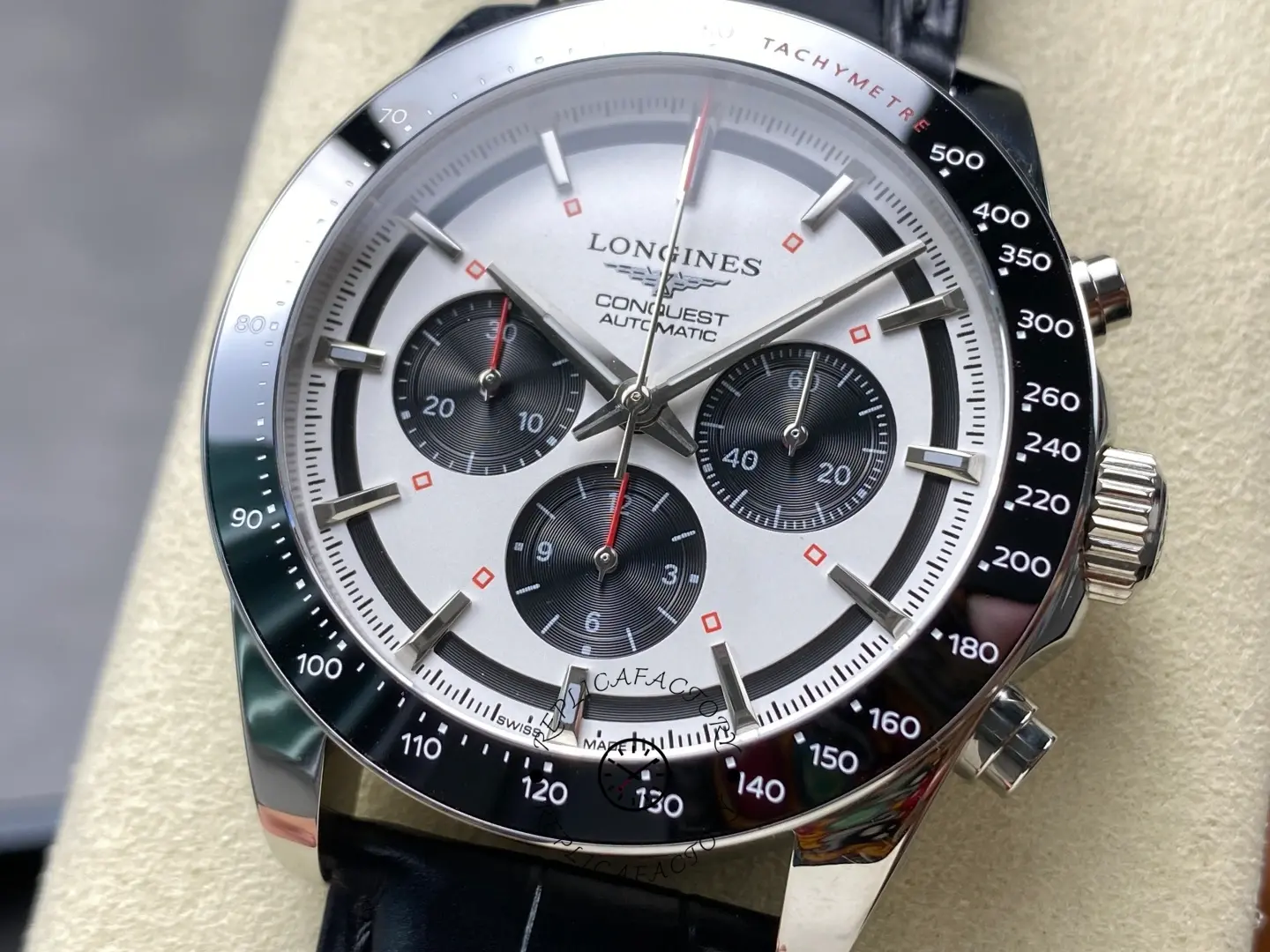 Longines Conquest Chronograph L3.835.4.72.6, dial close-up showing silver dial with black subdials and red accents.