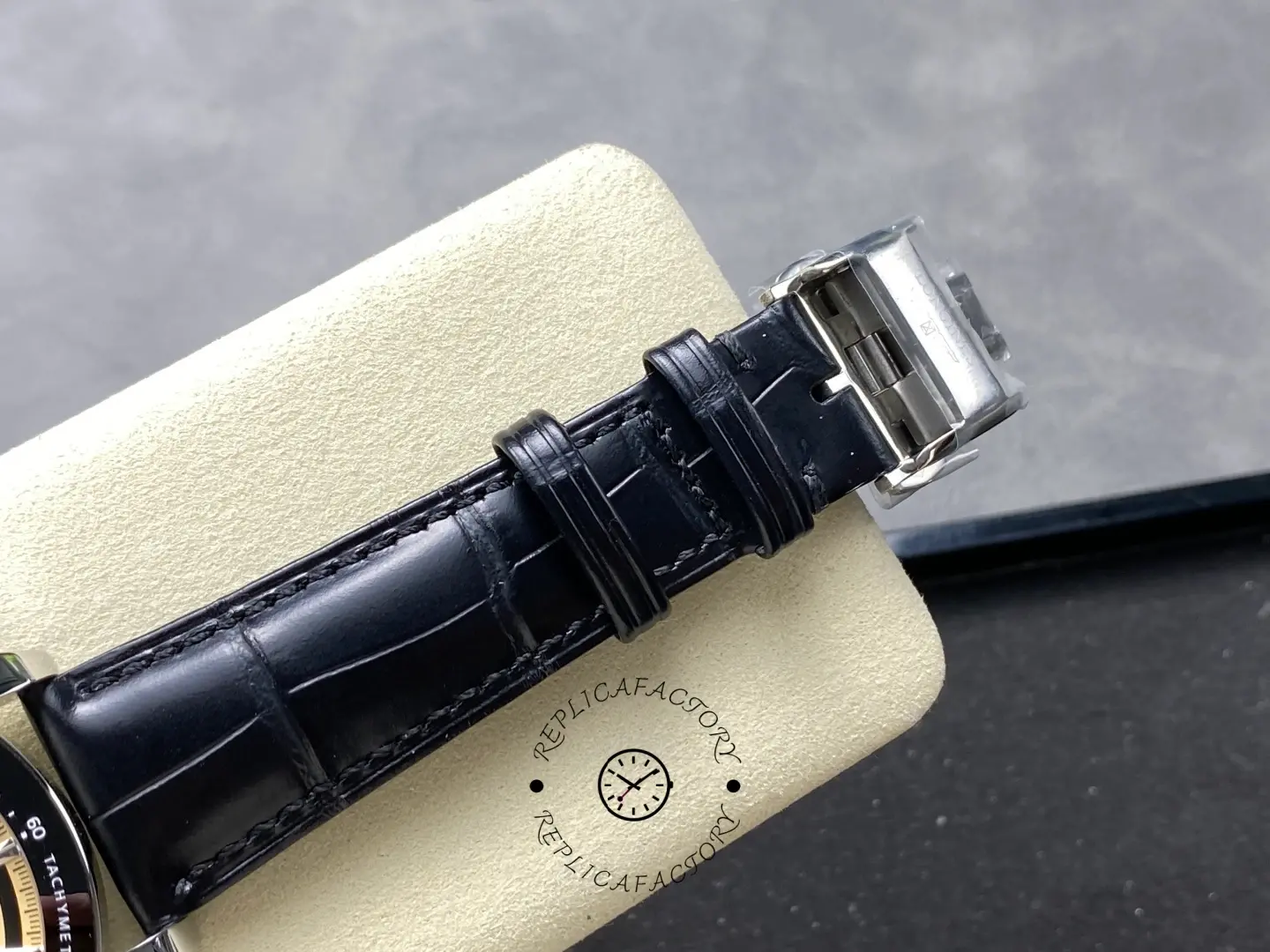 Longines L3.835.4.32.9 folding clasp close-up on black leather strap.