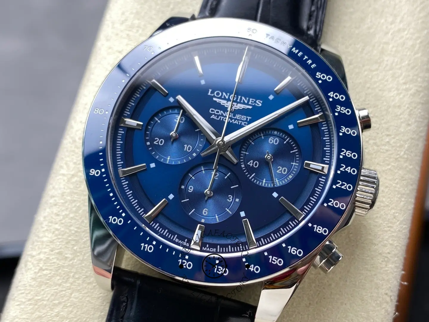Close-up of the Longines Conquest L3.835.4.92.6 blue chronograph dial with tachymeter bezel.