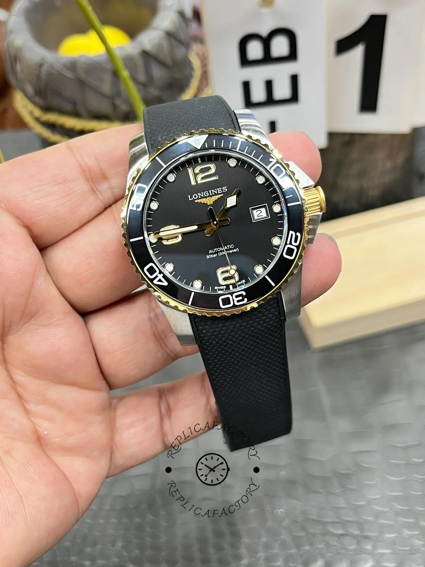 Full front shot of Longines HydroConquest L3.781.3.56.9 held in hand, showing overall design.