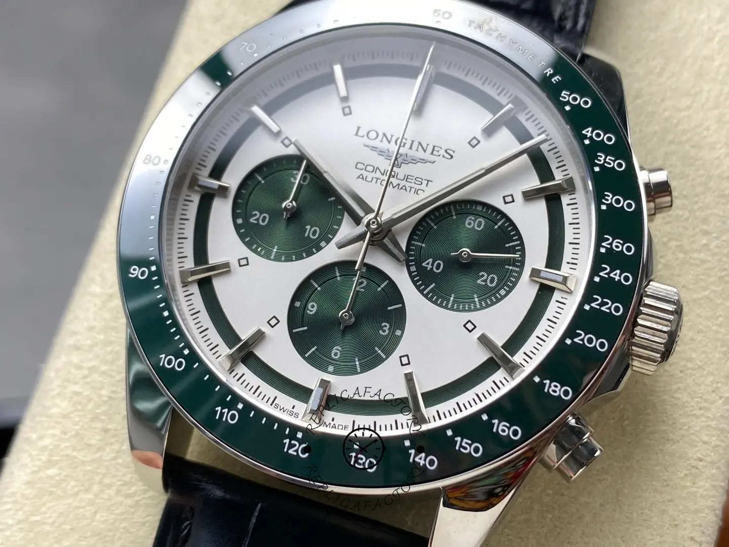 Longines Conquest Chronograph L3.835.4.02.6, close-up of silver dial with green subdials and polished hands.