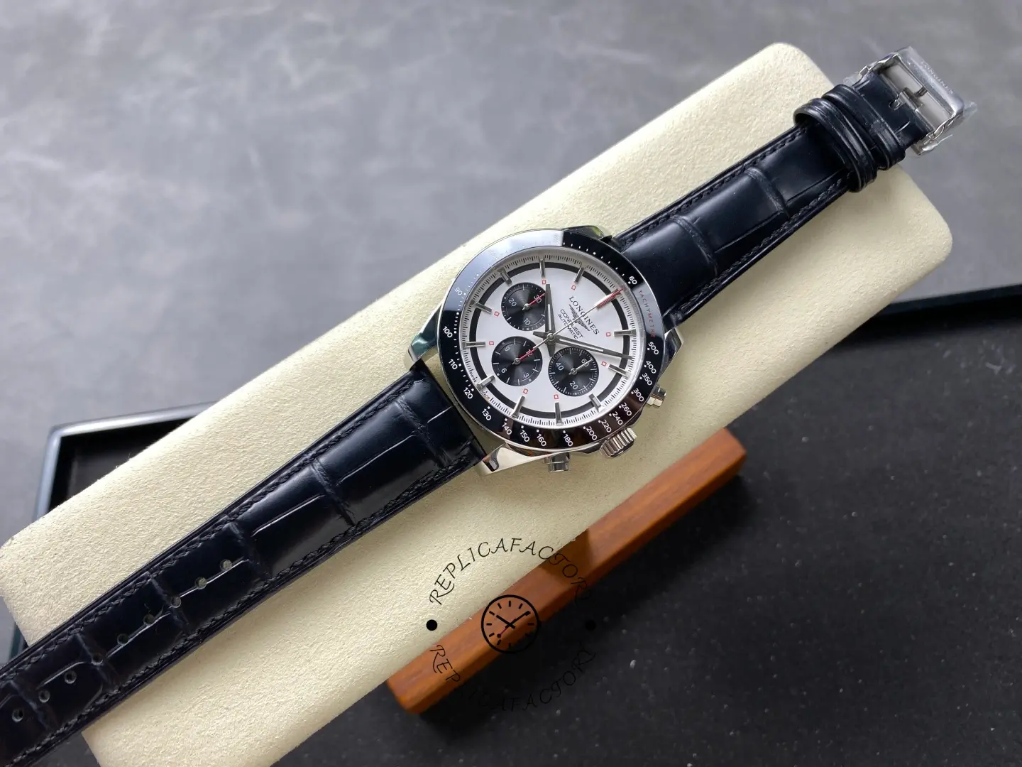 Longines Conquest Chronograph L3.835.4.72.6, full view with black leather strap on display stand.