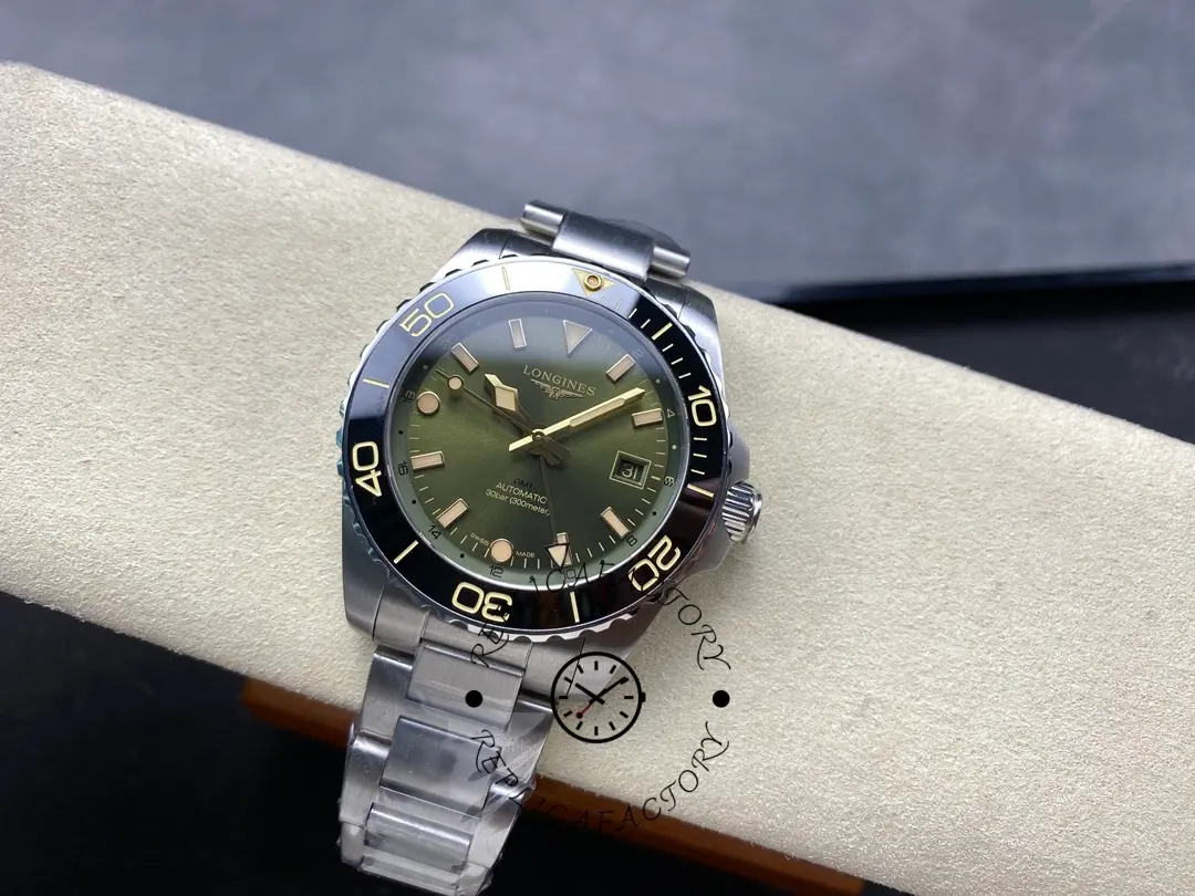 Angled full view of Longines HydroConquest GMT L3.790.4.06.6 with green dial and black bezel.