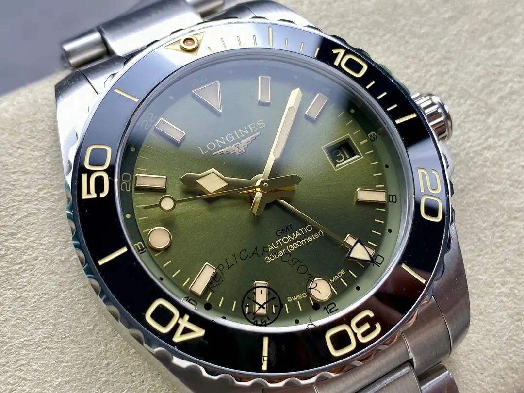 Close-up of Longines HydroConquest GMT L3.790.4.06.6 green dial with gold accents and date display.