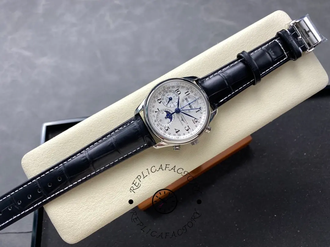 Full watch view of Longines L2.673.4.78.3 on black leather strap, laid on a display cushion.