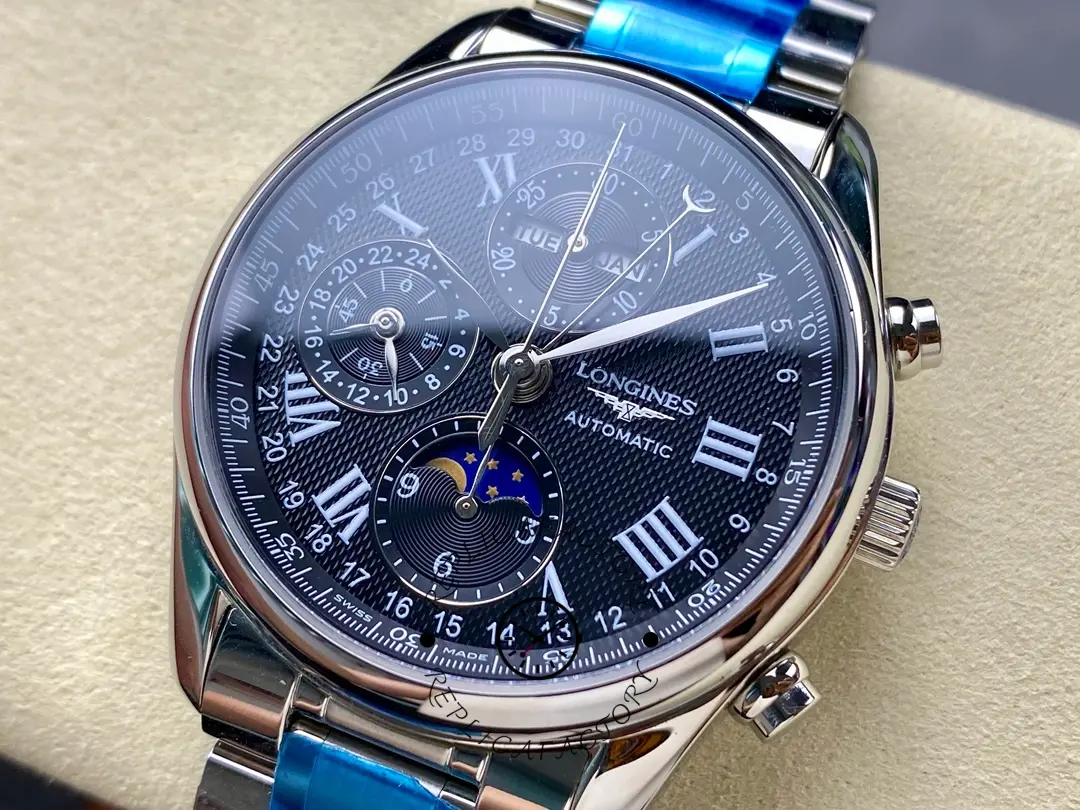 Detailed shot of Longines Master Collection L2.673.4.51.6 dial showing date, day, month, and moonphase functions.