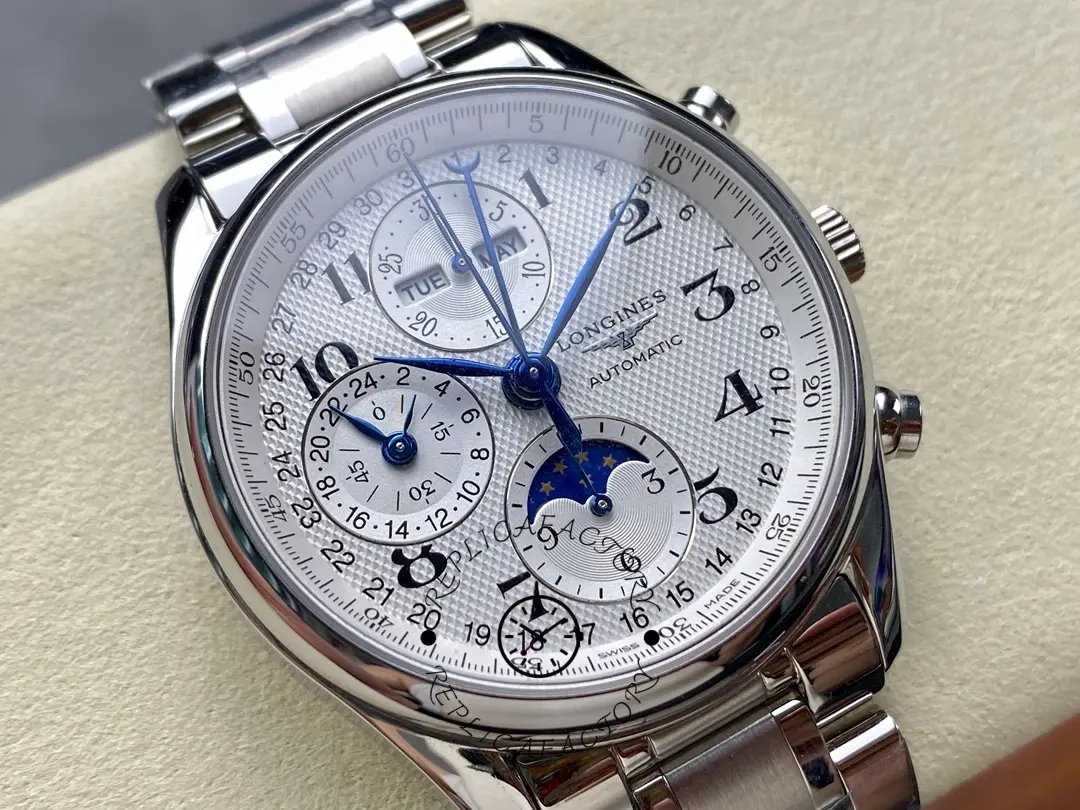 Macro dial shot of Longines Master Collection L2.673.4.78.6 with day-date and moonphase display.