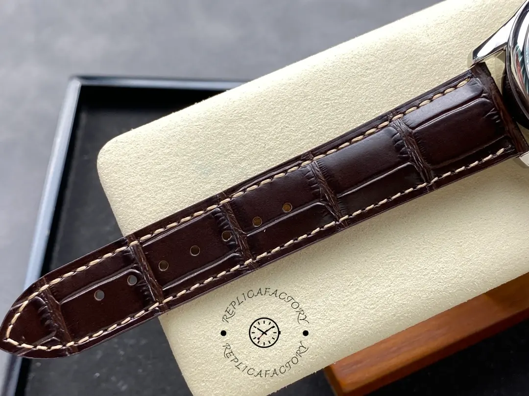 Longines L2.673.4.78.3 strap detail showing brown leather grain, stitching, and sizing holes.