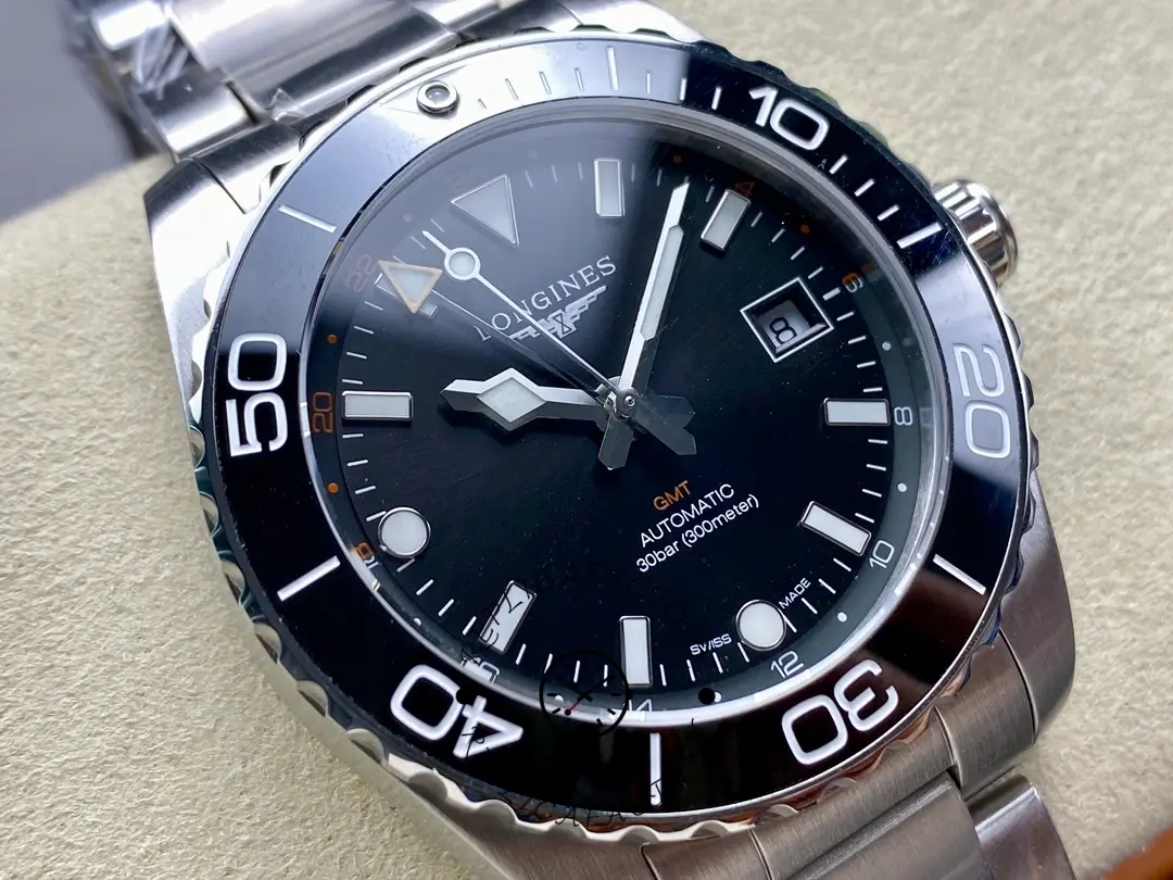 Angled dial view of Longines HydroConquest GMT L3.790.4.56.6 with black dial, date window, and bezel.