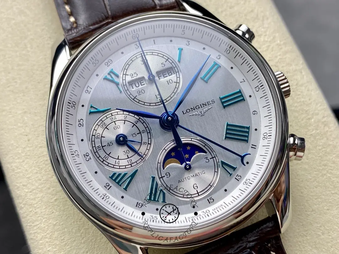Longines L2.673.4.78.3 dial close-up, blue hands, day-month at 12 o’clock, moonphase at 6 o’clock.