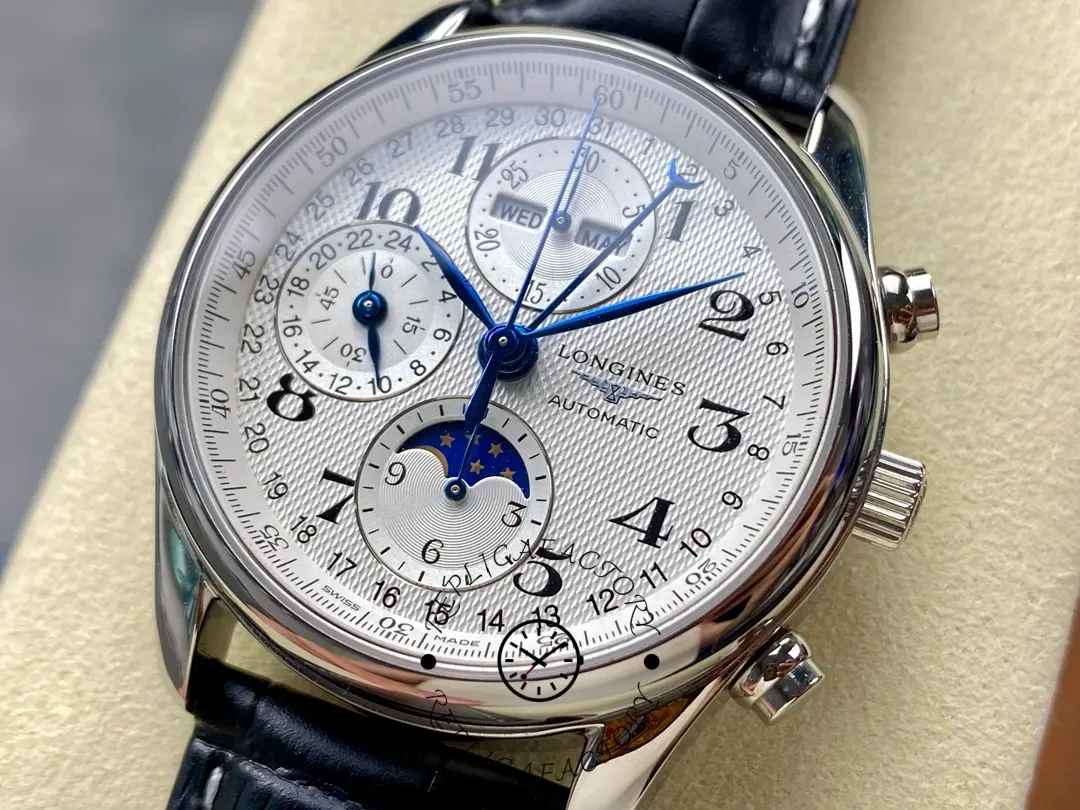 Angled dial shot of Longines L2.673.4.78.3 with Arabic numerals, blue hands, and moonphase subdial.