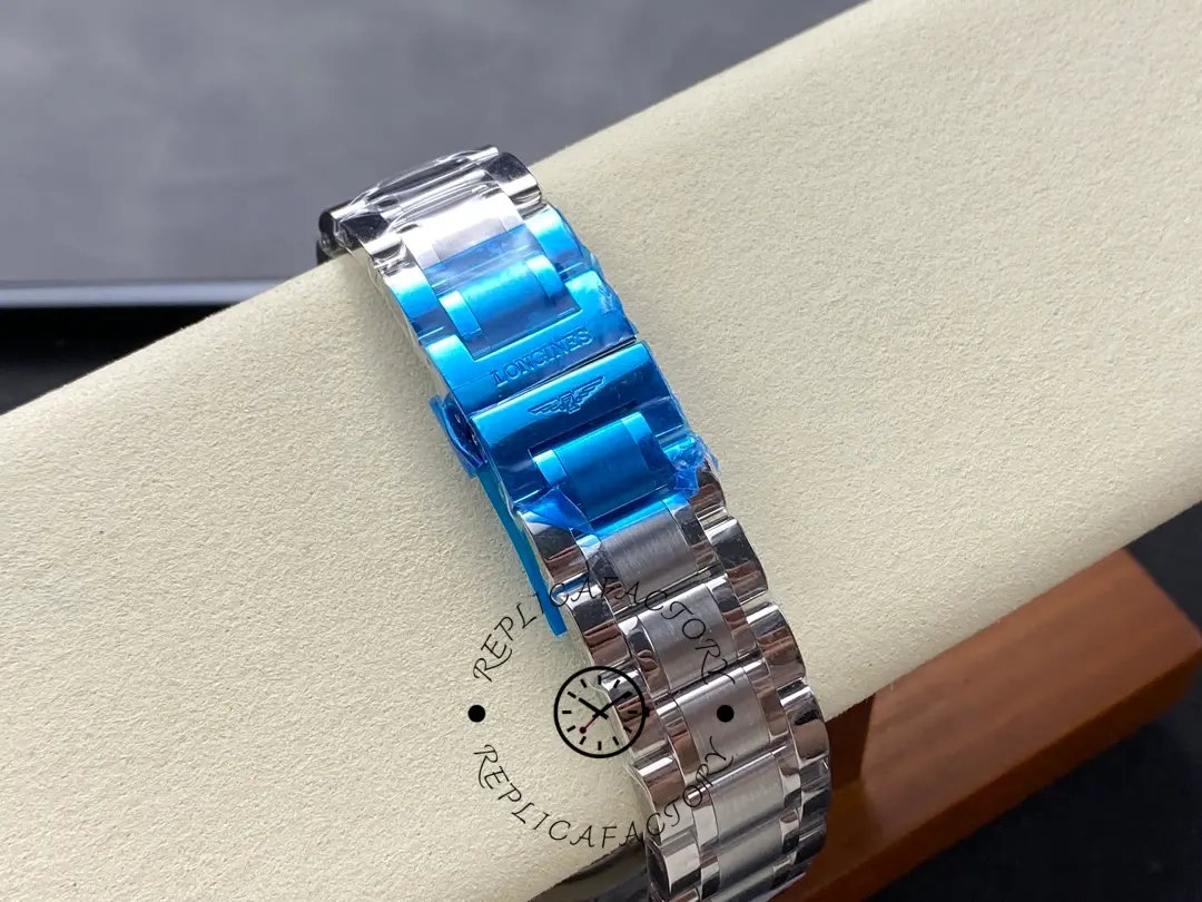 Longines L2.673.4.92.6 clasp detail, stainless-steel bracelet with blue protective film.