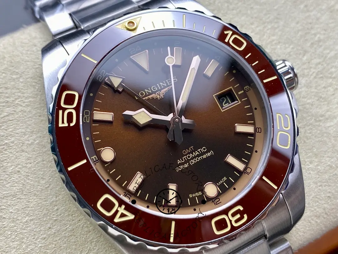 Angled dial view of Longines HydroConquest GMT L3.790.4.66.6, brown sunburst dial and GMT hand.