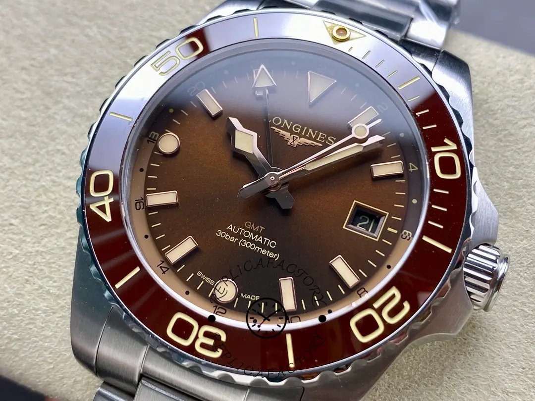 Close-up of Longines HydroConquest GMT L3.790.4.66.6, brown dial markers and red ceramic bezel.