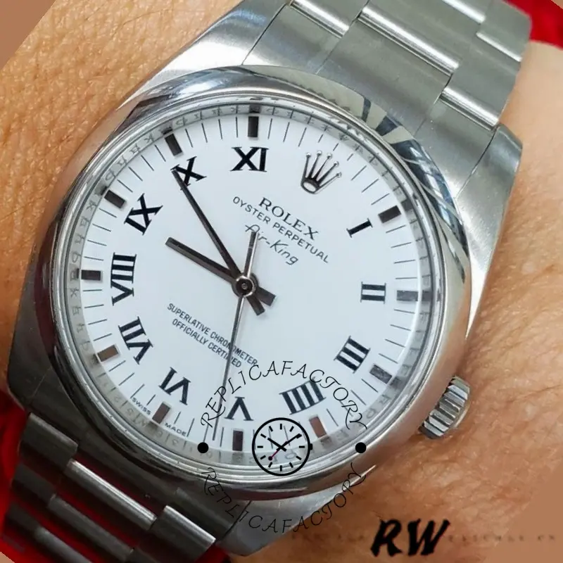 Rolex Oyster Perpetual Air-King 114200, white Roman dial close-up, smooth bezel on wrist.