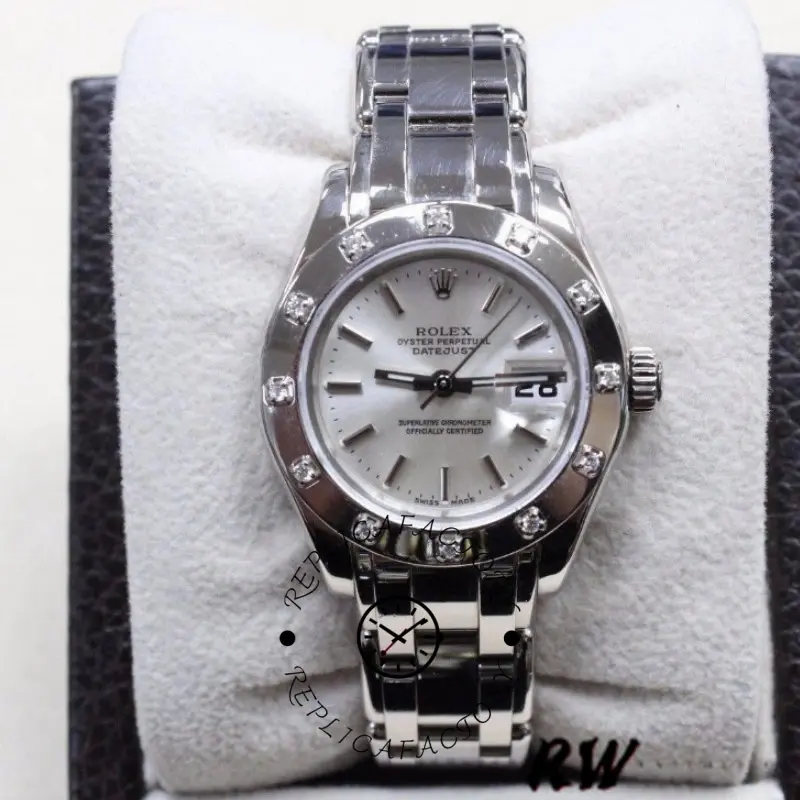 Rolex Pearlmaster 80319, front view on pillow showing white dial and bracelet.