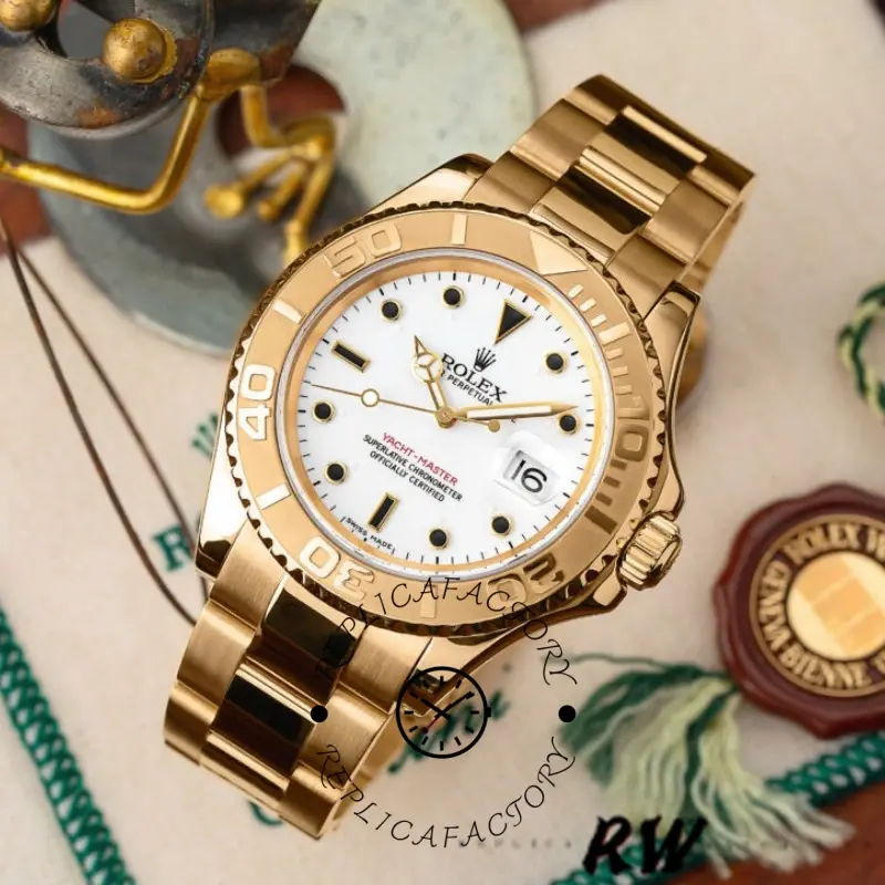 Angled display of the Rolex Yacht-Master 16628 showing white dial and gold bezel on props.