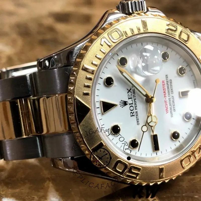 Rolex Yacht-Master 16623, dial close-up showing white dial, gold bezel numerals, and date.