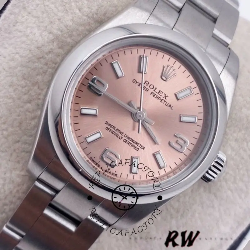 Rolex Oyster Perpetual 176200 close-up, pink dial and domed bezel, angled view.